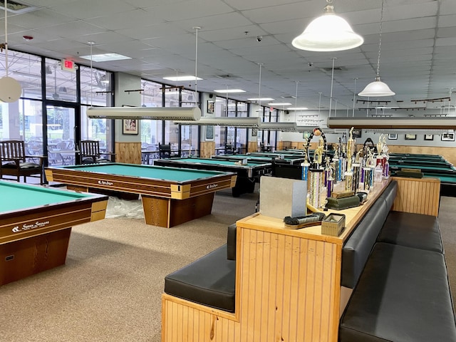 recreation room with pool table, a drop ceiling, and carpet