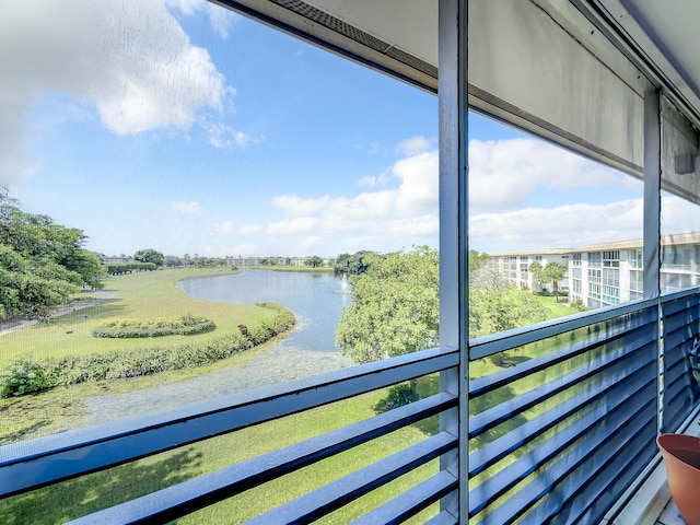 balcony featuring a water view