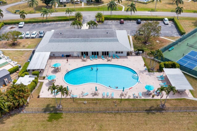 view of subject property featuring a pool
