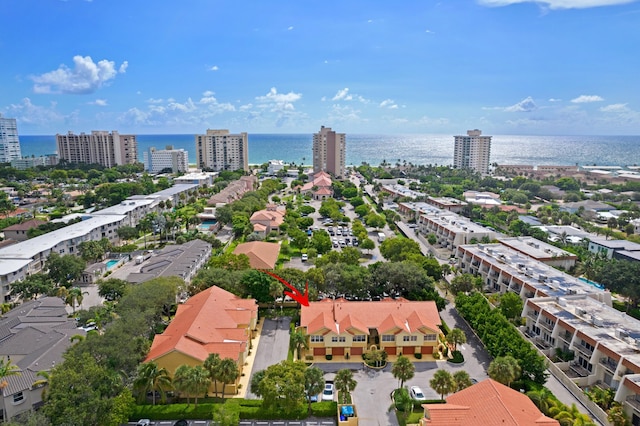 aerial view featuring a water view and a city view