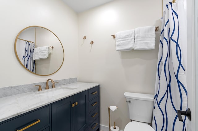 bathroom with toilet and vanity