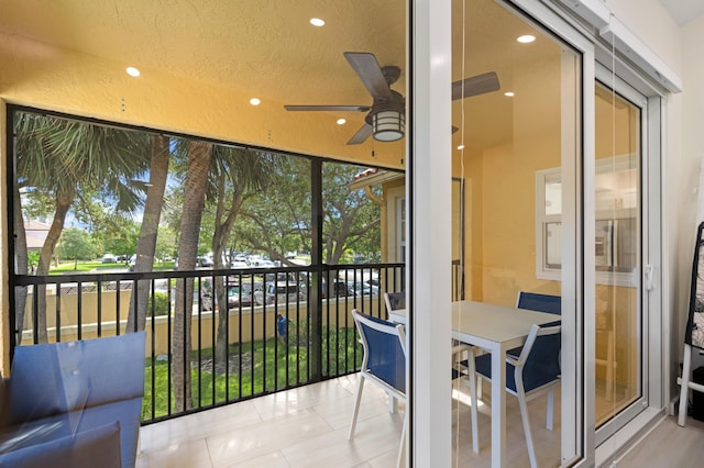 balcony featuring a ceiling fan
