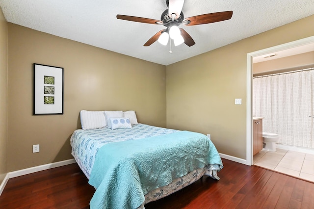 1125 Crystal Way Unit I, Delray Beach, FL 33444 - bedroom featuring baseboards, wood-type flooring, ensuite bath, and ceiling fan
