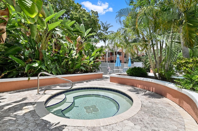 1125 Crystal Way Unit I, Delray Beach, FL 33444 - view of pool featuring a community hot tub and fence