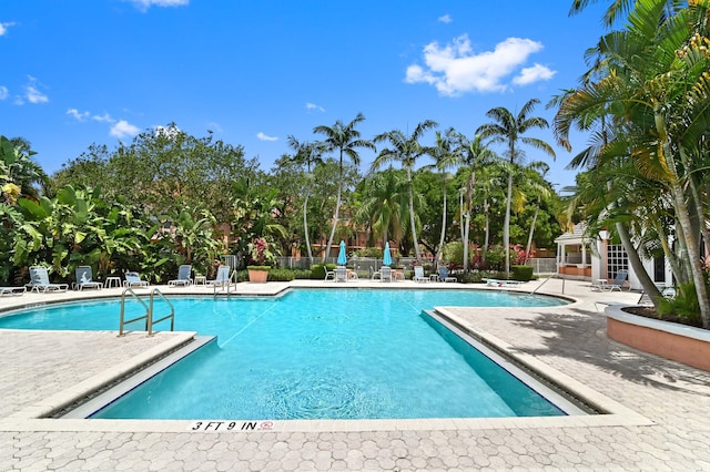 1125 Crystal Way Unit I, Delray Beach, FL 33444 - community pool featuring a patio, view of wooded area, and fence