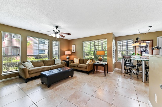 1125 Crystal Way Unit I, Delray Beach, FL 33444 - living room featuring plenty of natural light, a textured ceiling, ceiling fan, and baseboards