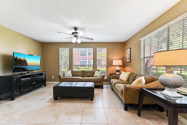 1125 Crystal Way Unit I, Delray Beach, FL 33444 - living area featuring healthy amount of natural light, ceiling fan, light tile patterned flooring, and a textured ceiling