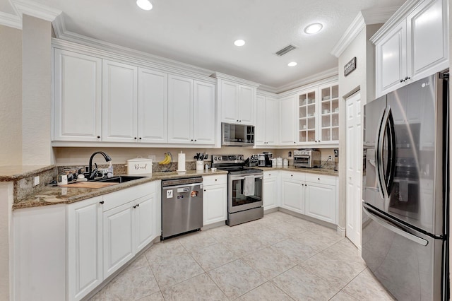 5742 NW 119th Ter, Coral Springs, FL 33076 - kitchen featuring stainless steel appliances, visible vents, ornamental molding, and a sink