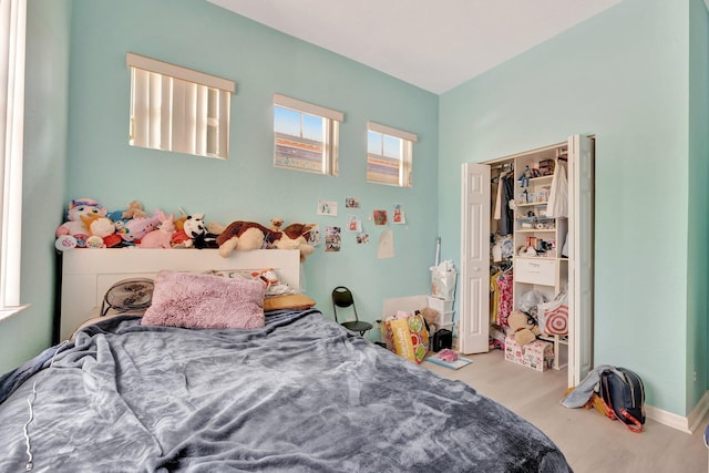 5742 NW 119th Ter, Coral Springs, FL 33076 - bedroom featuring wood finished floors and a closet