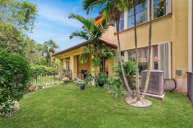 5742 NW 119th Ter, Coral Springs, FL 33076 - view of yard featuring central air condition unit and fence