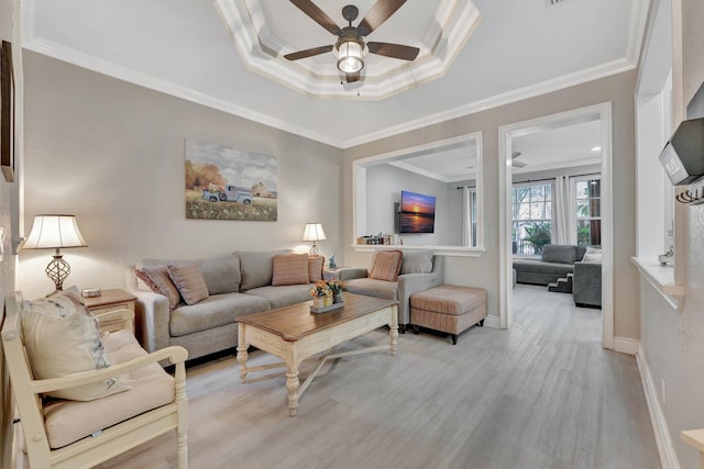 5742 NW 119th Ter, Coral Springs, FL 33076 - living room with a ceiling fan, light wood-style floors, a raised ceiling, crown molding, and baseboards