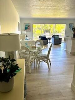 dining area with light wood-style flooring