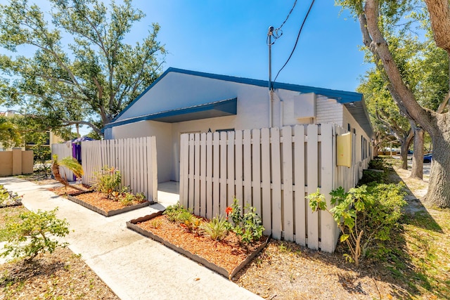 2015 Oleander Blvd Unit A, Fort Pierce, FL 34950 - view of property exterior featuring stucco siding and fence