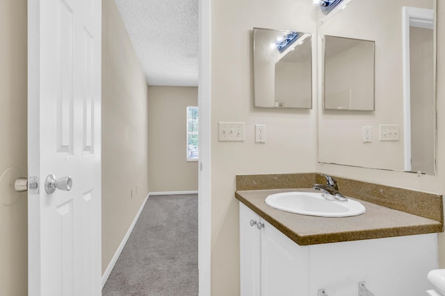 2015 Oleander Blvd Unit A, Fort Pierce, FL 34950 - bathroom featuring vanity, baseboards, and a textured ceiling