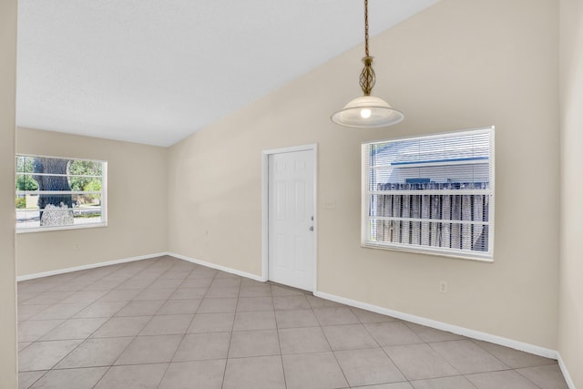 2015 Oleander Blvd Unit A, Fort Pierce, FL 34950 - foyer entrance with baseboards, light tile patterned flooring, and high vaulted ceiling