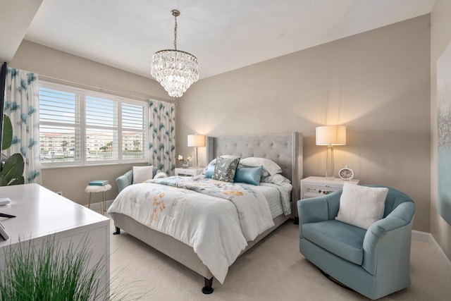 bedroom featuring baseboards and a notable chandelier