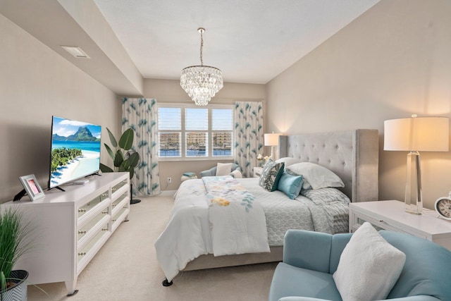 bedroom featuring light carpet, a notable chandelier, and visible vents