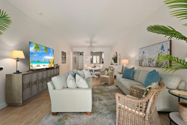 living room with baseboards and wood finished floors