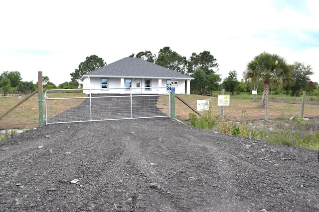 15722 NW 270th St, Okeechobee, FL 34972 - view of front of house with a gate, fence, and stucco siding