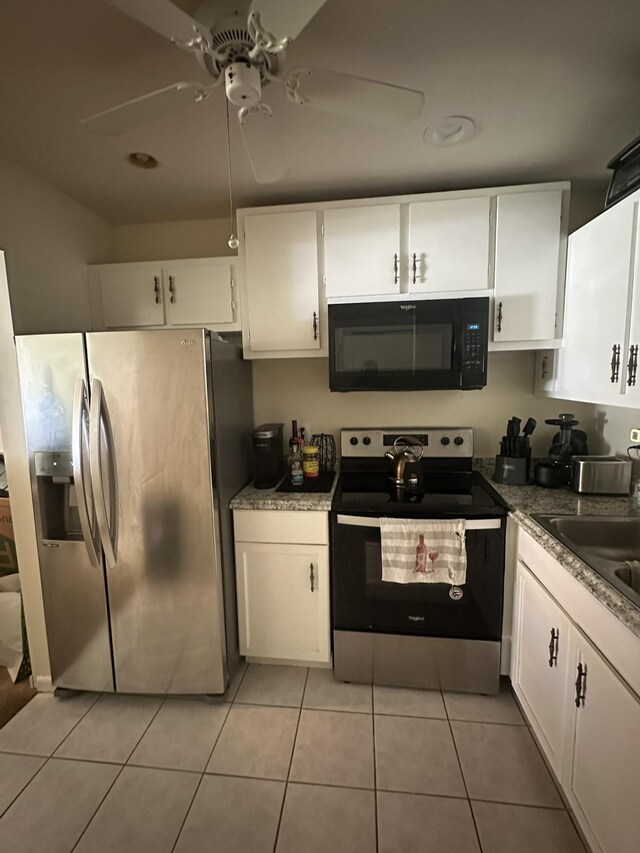 933 Savannas Point Dr Unit C, Fort Pierce, FL 34982 - kitchen featuring appliances with stainless steel finishes, white cabinetry, a sink, a ceiling fan, and light tile patterned flooring