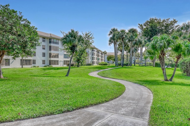 view of home's community featuring a lawn