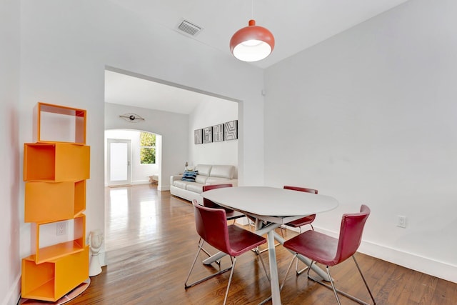 430 NE 121st St, Biscayne Park, FL 33161 - dining area with vaulted ceiling, wood finished floors, visible vents, and baseboards