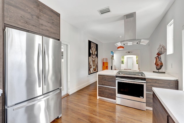 430 NE 121st St, Biscayne Park, FL 33161 - kitchen with visible vents, island range hood, modern cabinets, and appliances with stainless steel finishes