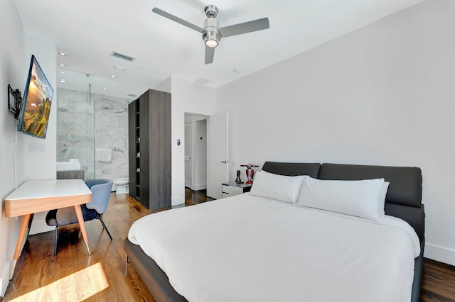 430 NE 121st St, Biscayne Park, FL 33161 - bedroom featuring wood finished floors, ensuite bath, visible vents, a ceiling fan, and baseboards