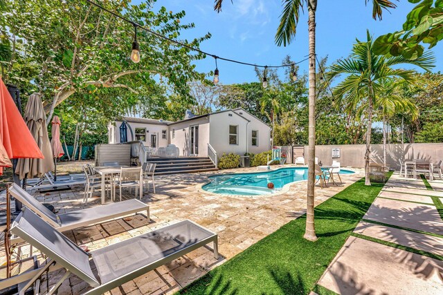 430 NE 121st St, Biscayne Park, FL 33161 - view of pool with a fenced backyard, a patio, a fenced in pool, and outdoor dining area