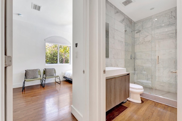 430 NE 121st St, Biscayne Park, FL 33161 - bathroom featuring visible vents, wood finished floors, and a shower stall