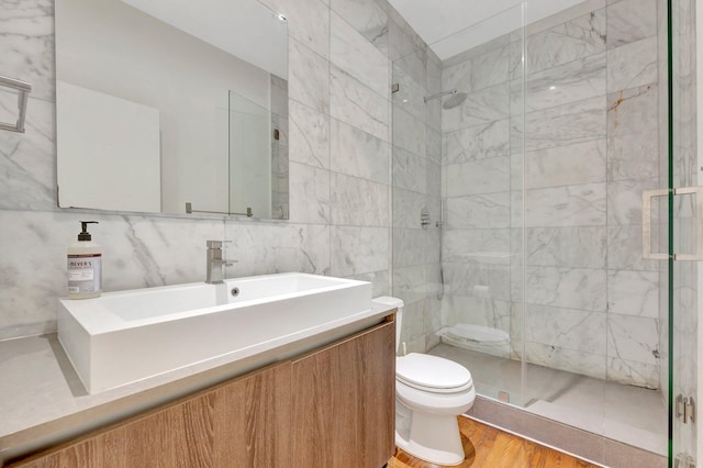 430 NE 121st St, Biscayne Park, FL 33161 - full bathroom with a shower stall, vanity, toilet, and wood finished floors