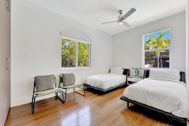 430 NE 121st St, Biscayne Park, FL 33161 - bedroom featuring baseboards, multiple windows, and wood finished floors