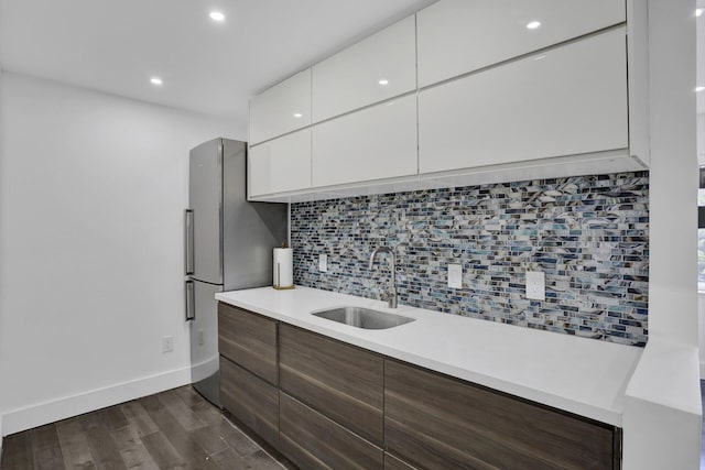 430 NE 121st St, Biscayne Park, FL 33161 - kitchen featuring a sink, dark wood finished floors, modern cabinets, light countertops, and tasteful backsplash