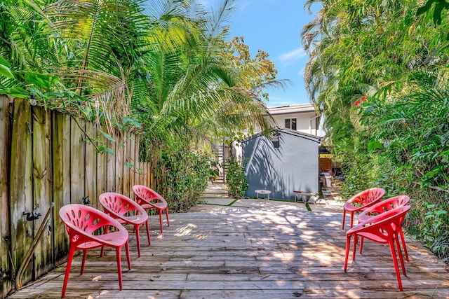 430 NE 121st St, Biscayne Park, FL 33161 - deck with a storage shed, an outbuilding, and fence