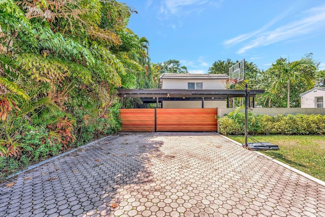 430 NE 121st St, Biscayne Park, FL 33161 - view of front of house with stucco siding, fence, and a gate