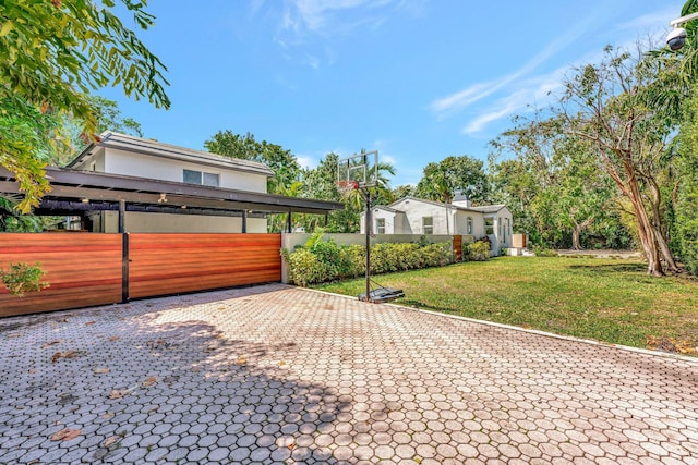 430 NE 121st St, Biscayne Park, FL 33161 - view of front of house with a front lawn, stucco siding, a gate, and fence