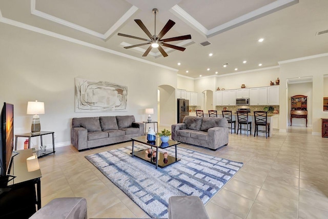 964 SW Canoe Creek Ter, Palm City, FL 34990 - living room featuring recessed lighting, light tile patterned floors, ceiling fan, crown molding, and arched walkways