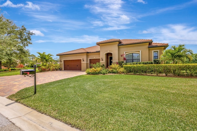 964 SW Canoe Creek Ter, Palm City, FL 34990 - mediterranean / spanish-style home featuring a garage, stucco siding, decorative driveway, and a front yard