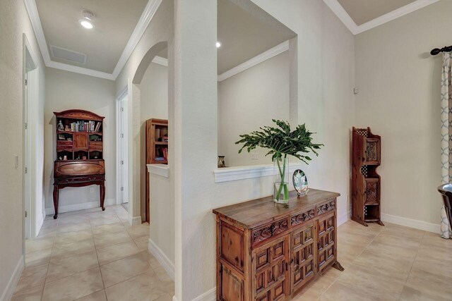 964 SW Canoe Creek Ter, Palm City, FL 34990 - hall with arched walkways, ornamental molding, visible vents, and light tile patterned flooring