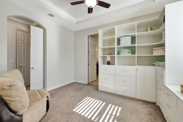 964 SW Canoe Creek Ter, Palm City, FL 34990 - living area with a ceiling fan, visible vents, arched walkways, light carpet, and ornamental molding