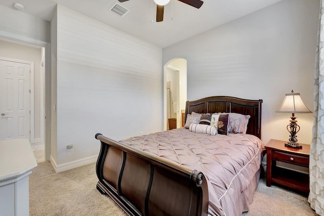 964 SW Canoe Creek Ter, Palm City, FL 34990 - bedroom with a ceiling fan, visible vents, baseboards, arched walkways, and light colored carpet