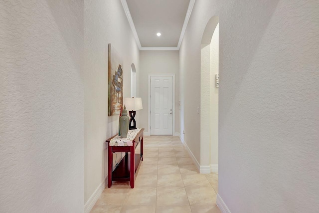 964 SW Canoe Creek Ter, Palm City, FL 34990 - hallway with crown molding, a textured wall, arched walkways, and light tile patterned floors