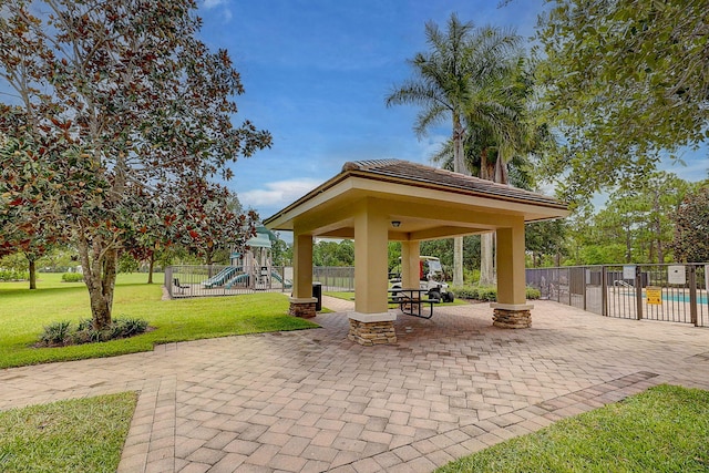 964 SW Canoe Creek Ter, Palm City, FL 34990 - view of property's community with a lawn, a gazebo, playground community, and fence