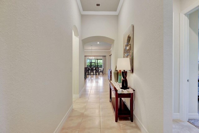 964 SW Canoe Creek Ter, Palm City, FL 34990 - hall with arched walkways, ornamental molding, visible vents, and a textured wall
