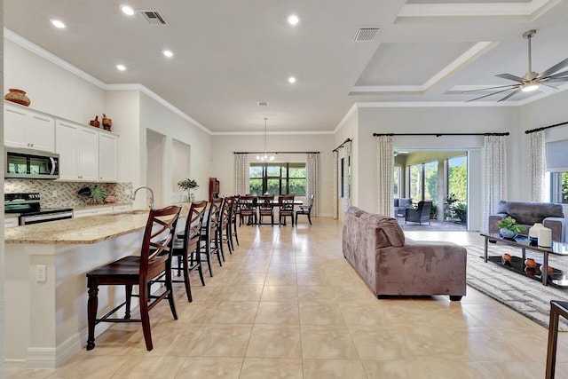 964 SW Canoe Creek Ter, Palm City, FL 34990 - living area with light tile patterned floors, recessed lighting, visible vents, and a ceiling fan
