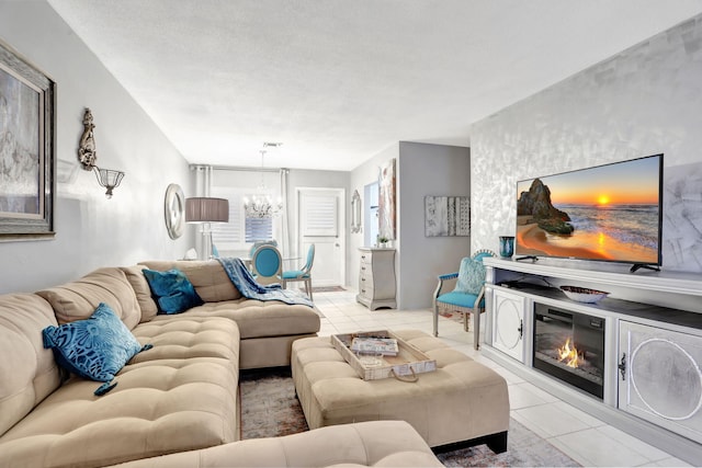 living area with a chandelier and light tile patterned floors
