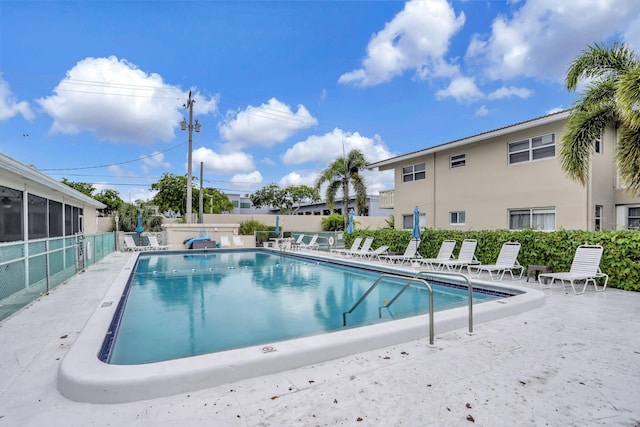 view of property featuring uncovered parking and a residential view