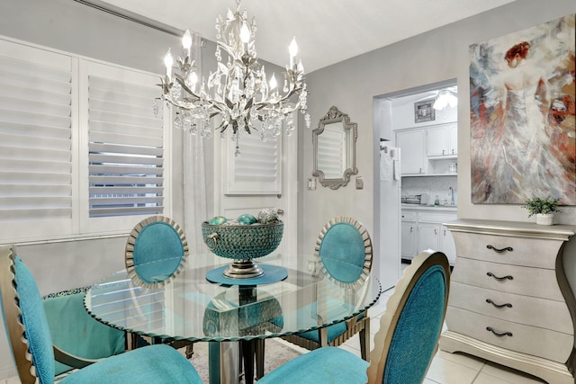 dining space featuring a chandelier and light tile patterned flooring
