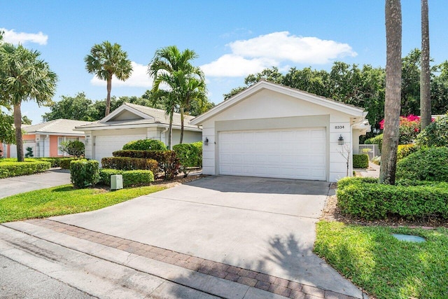 8334 Old Forest Rd, Palm Beach Gardens, FL 33410 - ranch-style home featuring stucco siding and a garage