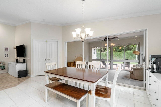 dining room featuring light tile patterned floors, ceiling fan with notable chandelier, and ornamental molding